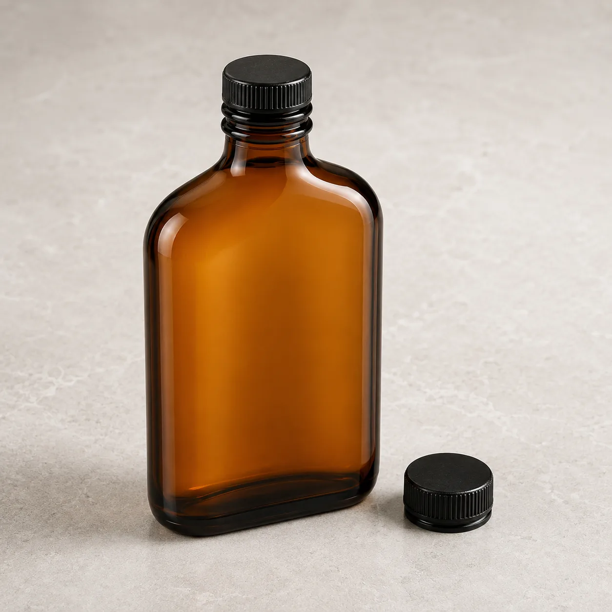 Angled side view of Amber Glass Flask Beverage Bottle showing the outer profile
