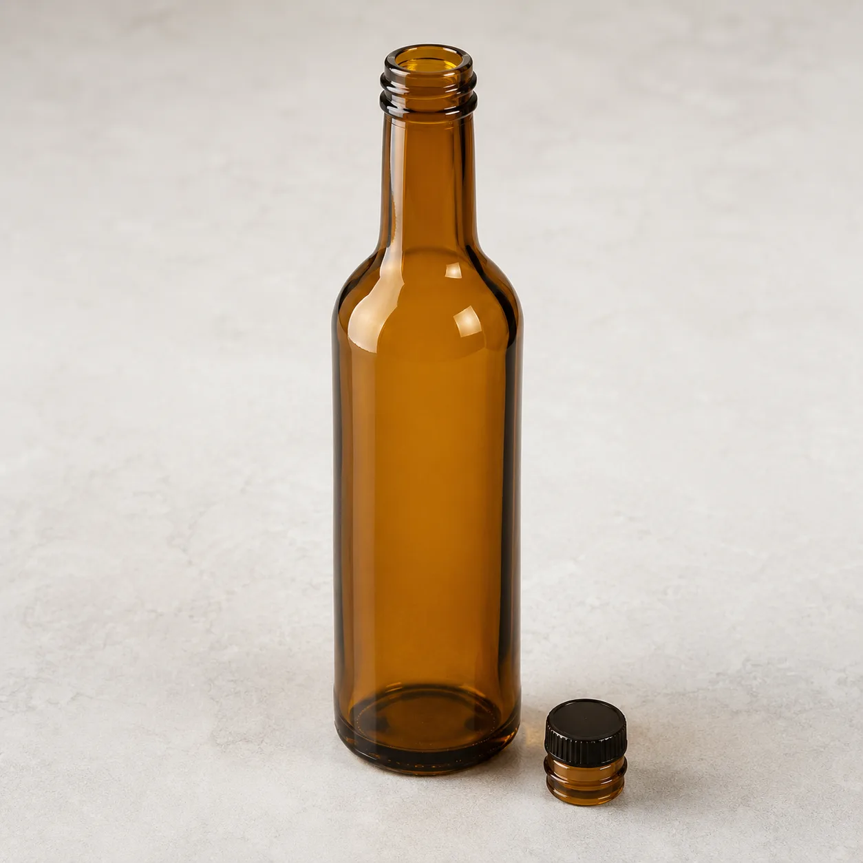 Angled side view of Amber Glass Vinegar Bottle showing the outer profile