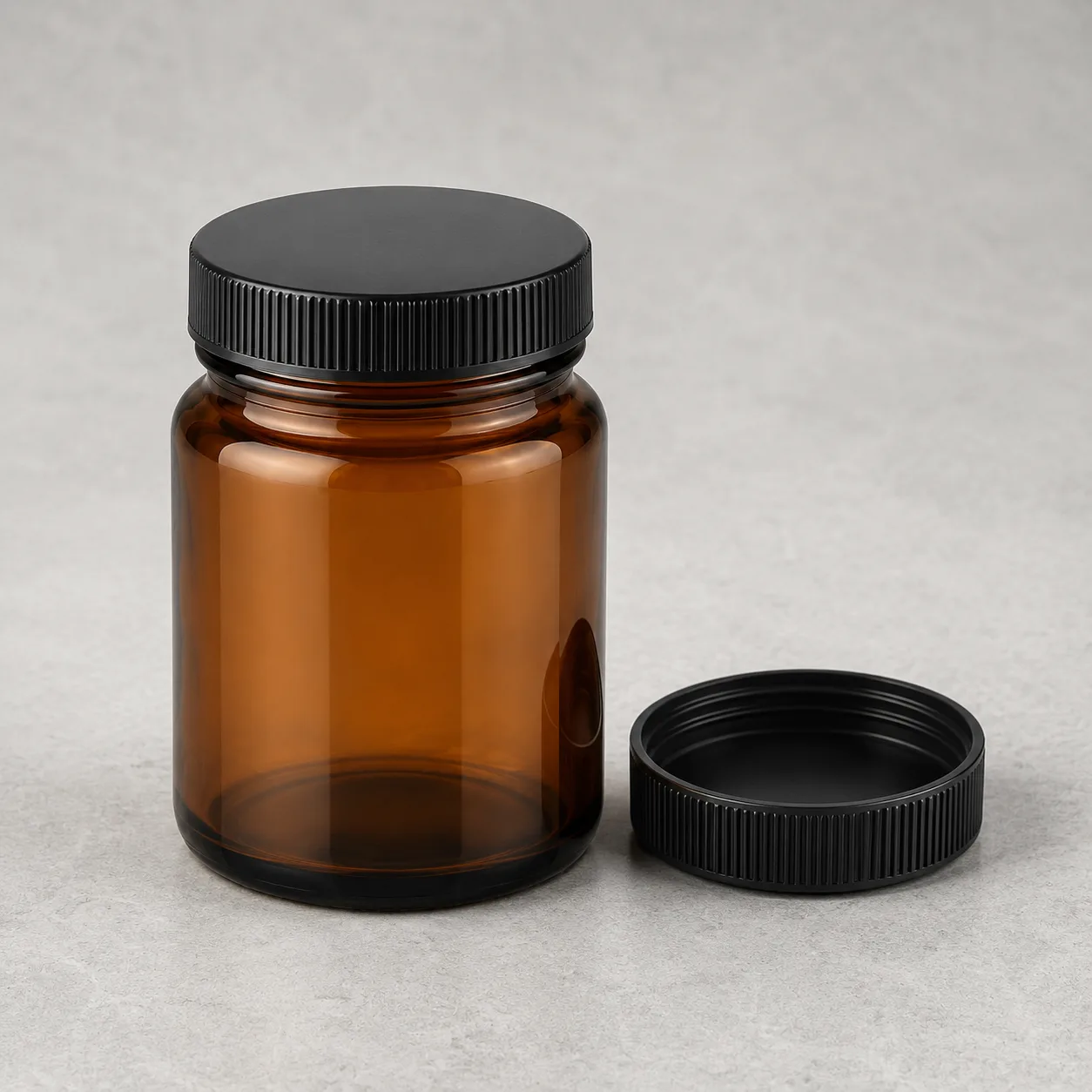 Angled side view of Amber Glass Wide-Mouth Jar showing the outer profile
