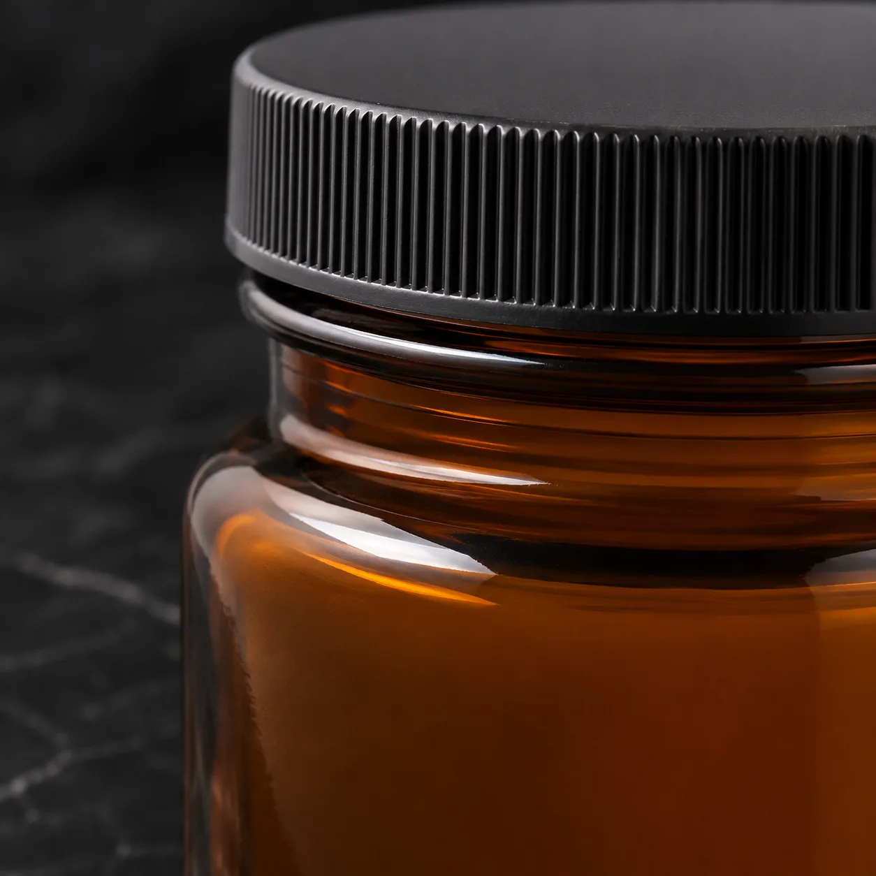 Close view of Amber Glass Wide-Mouth Jar showing label area and print / coat / label