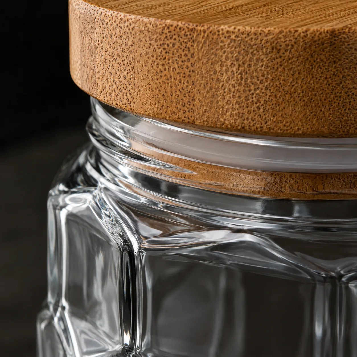 Close view of Faceted Food Jar showing glass wall and faceted surface detail