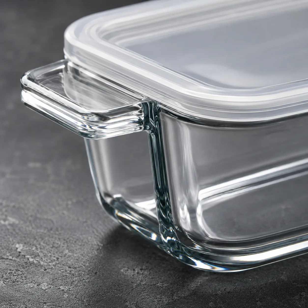 Close view of Glass Baking Dish with Lid showing glass wall and label / lid branding