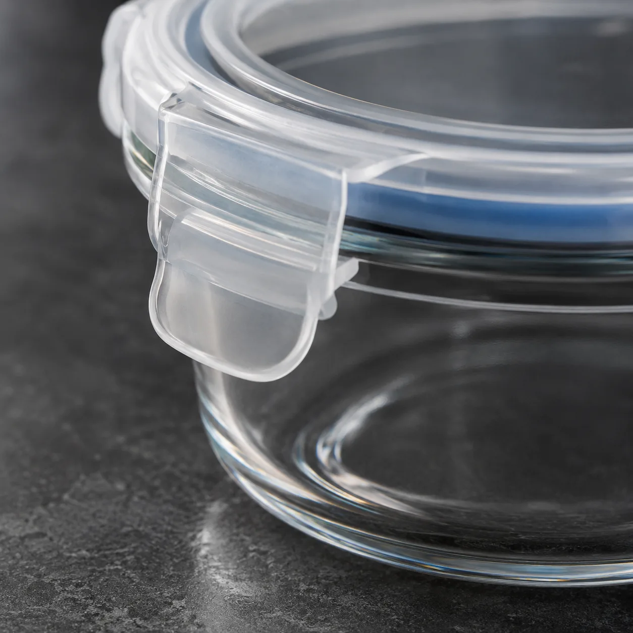 Close view of Glass Food Storage Bowl with Lid showing glass wall and label / lid branding