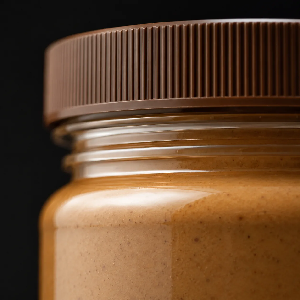 Close view of Nut Butter Jar showing glass wall and label / lid branding