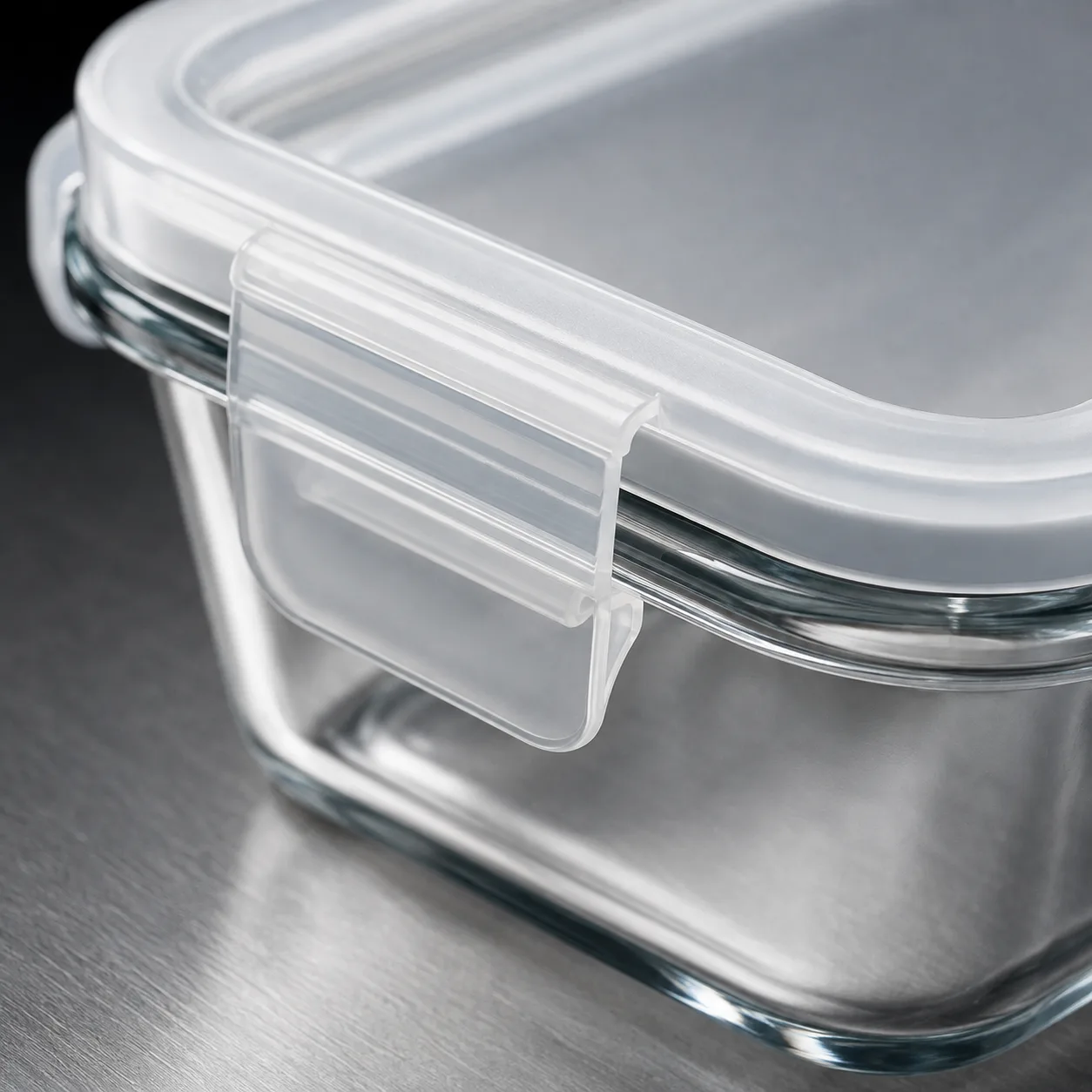 Close view of Rectangular Glass Food Storage Container showing glass wall and label / lid branding