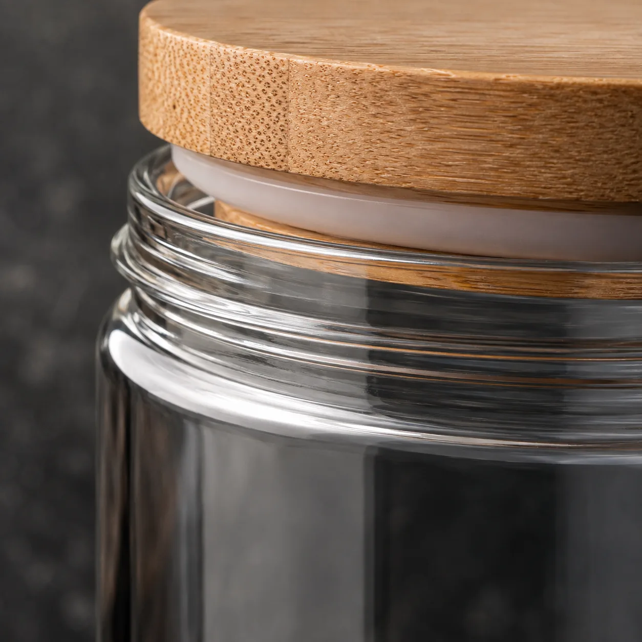 Close view of Straight-Sided Food Jar showing glass wall and label / lid branding