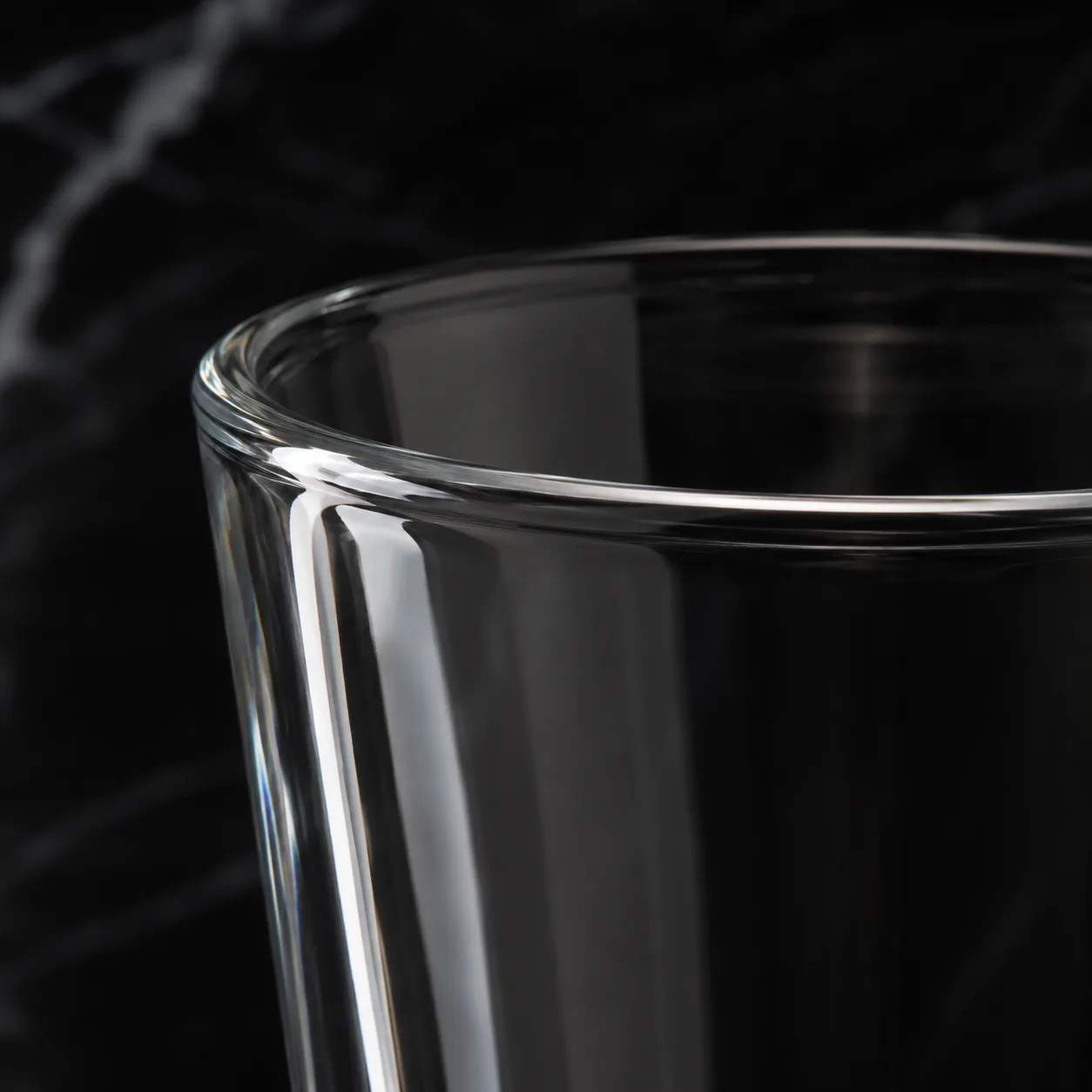 Close view of Latte Glass showing stem or base and logo print / decal