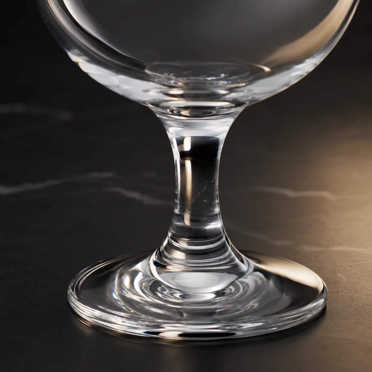 Close view of Water Goblet showing stem or base and logo print / decal