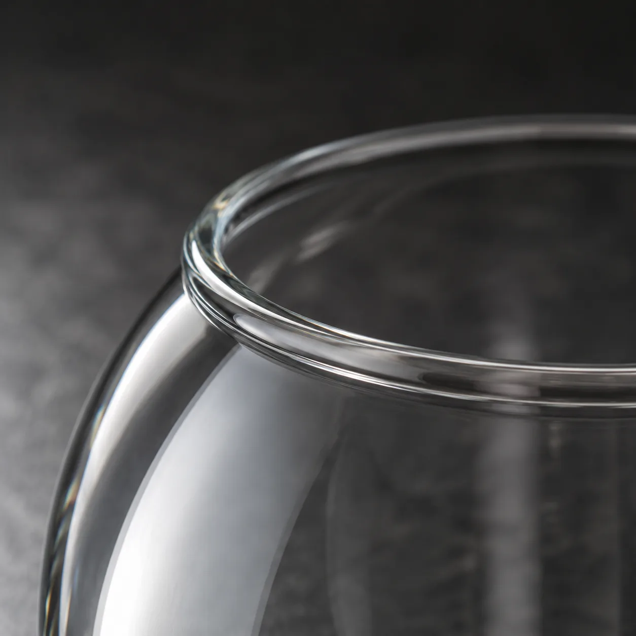 Close view of Glass Fish Bowl Vase showing base area and color / frost finish